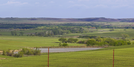 A wide shot of a Kansas prairie landscape