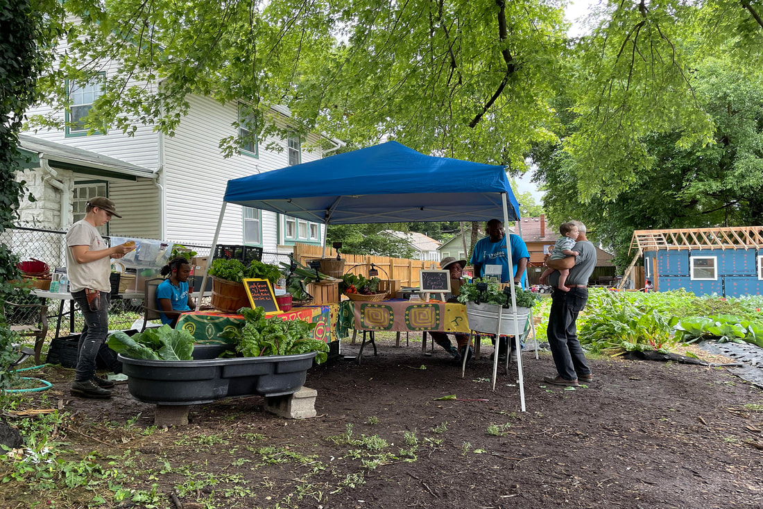 Image of people gathered at a farm stand